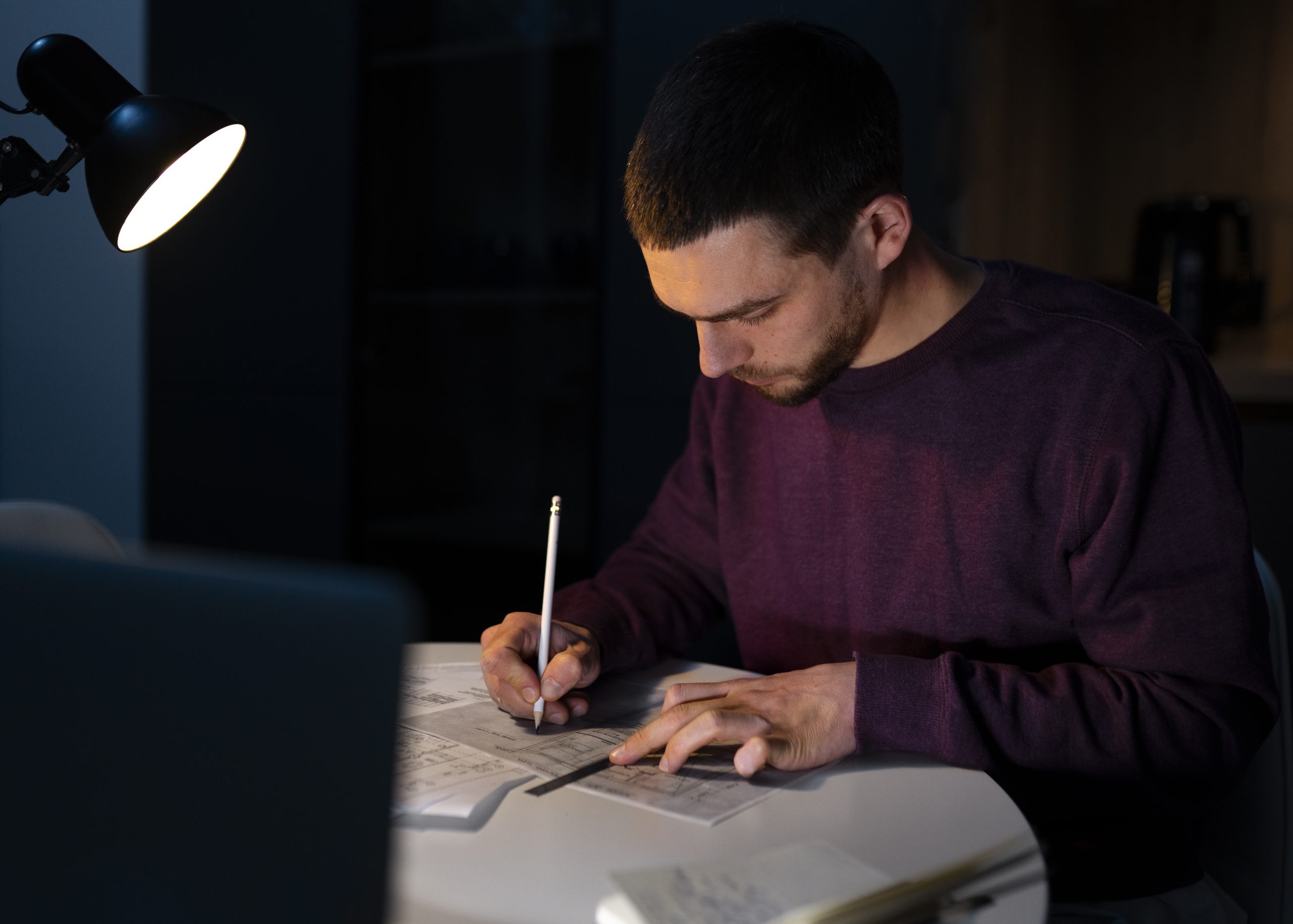 medium-shot-man-working-late-night